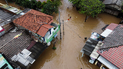 Canvas Print - Aerial POV view Depiction of flooding. devastation wrought after massive natural disasters. BEKASI, WEST JAVA, INDONESIA. FEBRUARY 23, 2021