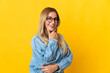 © luismolinero - Young blonde woman isolated on yellow background happy and smiling