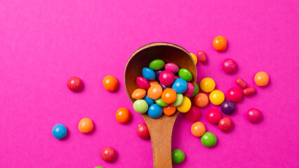 multicolored candy set with a wooden spoon