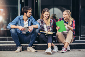 Education, campus, friendship and people concept. Group of happy students outdoor