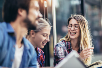 Education, campus, friendship and people concept. Group of happy students outdoor