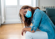 © SB Arts Media - Lonely woman suffering from depression at home during coronavirus lockdown and social distancing