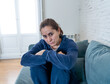 © SB Arts Media - Young sad woman suffering from depression feeling lonely and hopeless isolated at home