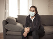 © SB Arts Media - Lonely woman suffering from depression at home during coronavirus lockdown and social distancing