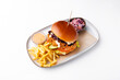 Photo of tasty delicious burger with fry potatoes and sauce over white background, fast food.
