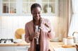 © Prostock-studio - Thirsty Black Woman Drinking Water In Kitchen, Pouring Healthy Liquid To Glass