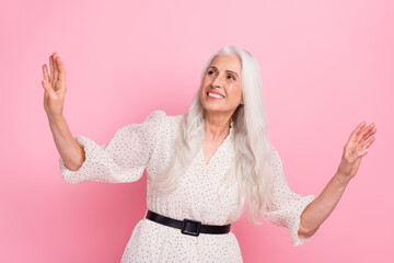 Sticker - Portrait of attractive cheerful elegant dreamy grey-haired woman posing searching isolated over pink pastel color background