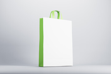 Poster - Eco friendly white and green blank paper bag at abstract light background. Mockup