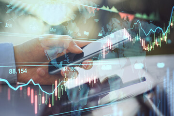 Poster - Online trading business concept with man hand using smartphone and transparent digital display with stock market graphs and diagram
