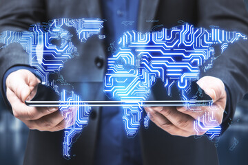 Poster - Worldwide business concept with microchip world map scheme at businessman with digital tablet background