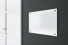 Light Blank Signage On Dark Wall Before The Entrance A Room With White Door. Mockup