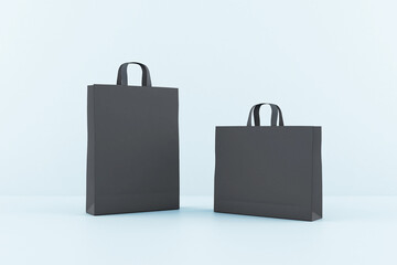 Poster - Blank black paper bags with a space for your sign at blue background. Mockup