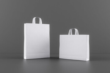 Poster - Blank white eco paper bags with a space for your logo at dark background. Mockup
