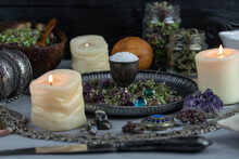 Magic Altar With Mystical Herbs, Salt, Candles And Crystals. Witch Sanctuary Sacred Esoteric Concept.