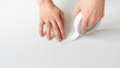 hands holding and a[[lying adhesive tape on the surface