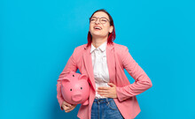Young Attractive Red Hair Woman Laughing Out Loud At Some Hilarious Joke, Feeling Happy And Cheerful, Having Fun. Humorous Business Concept.