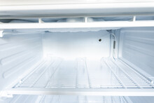 Domestic Fridge Freezer Defrost Problem Concept. Refrigerator Covered With Ice. Appliance Repair Concept