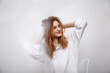 © ibilyk13 - Businesswoman confident portrait. Fashion shoot of young sexy in white studio street style. Fashion photo. Caucasian female with long hair. Close-up portrait of a beautiful girl of the European race.