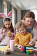 © pressmaster - Family preparing for Easter