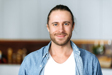 close-up portrait of a handsome attractive caucasian guy, student or freelancer. stylish young man i