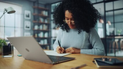 Aufkleber - Beautiful Authentic Latina Female Sitting at a Desk in a Cozy Living Room and Following a Video School Lesson on Laptop Computer. Student Studying Remotely. Chat with Friends on Social Network.