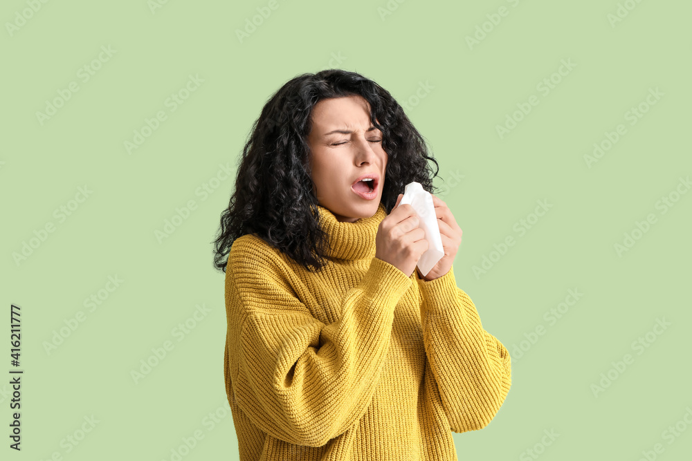Sick young woman on color background
