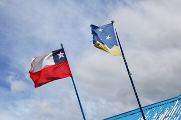 Wall Mural - The flag in the village of Patagonia, Chile