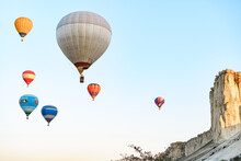 Colorful Air Balloons Flying In Clear Sky Near Huge White Mountain