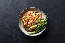 Pad Thai With Shrimp And Vegetables On A Dark Background, View From Above