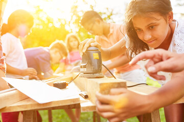 Group of children learning to work at summer camp