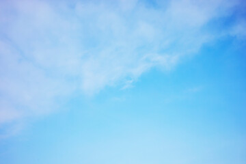 Wall Mural - Blue sky background and white clouds soft focus, and copy space horizontal shape