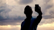Young, Man Taking Selfie Photo On Beautiful Beach During Sunset, Super Slow Motion, Shot At 240fps

