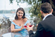 © zinkevych - Woman and man communicating in outdoor cafe