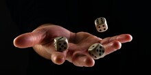 Female Hand Throwing Dice In The Air On Black Background. Fortune Concept Playing Dice. Luck Concept. Lucky Man