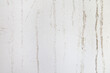 Water stain pattern on white concrete wall.
