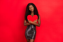 Photo Of Young Afro Girl Happy Positive Smile Dream Hug Paper Heart Valentine Day Romantic Isolated Over Red Color Background