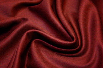 Wall Mural - Red woolen fabric with waves. Crumpled fabric. Woolen fabric for coat