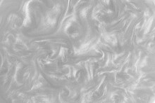 Silver Paint Background. Motion Of The Shiny Liquid. Color Of The Year 2021 Ultimate Grey. Waves On A Glittering Liquid Surface.