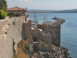 Wall Mural - Panorama along the walls of the fortified medieval village of Talamone with the Tyrrhenian Sea in the background