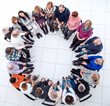 © ASDF - group of diverse mature people sitting in a circle.