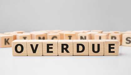 Poster - Word OVERDUE made with wood building blocks