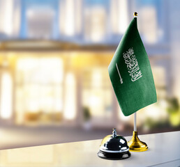 Sticker - Saudi Arabia flag on the reception desk in the lobby of the hotel