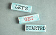 let's get started text on wooden block, business concept