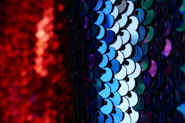 Wall Mural - Sequins macro background.Blue and red  sequins close-up. Bright  shining surface.Fabric with sequins .ridescent fabric.