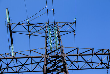 Power lines. High voltage power line against the blue sky.