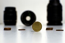 10 Cents Coin Close Up On Blurred Background With Photo Lenses