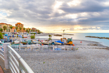 Morning sunlight along the Mediterranean Sea at the coastal resort town of Ventimiglia, Italy, on the Italian Riviera.