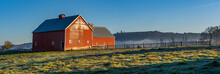 Red Barn With Rail Fence And A Pasture Field At Sunrise Near Jefferson, Oregon