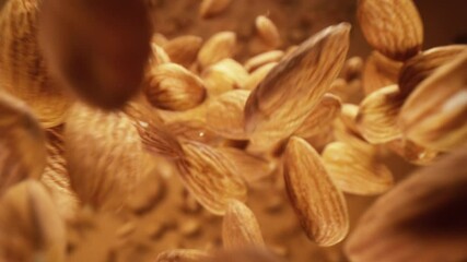 Poster - Super slow motion of falling almonds pieces, macro shot. Filmed on high speed cinema camera, 1000fps.