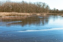 Partially Frozen Lake In Winter